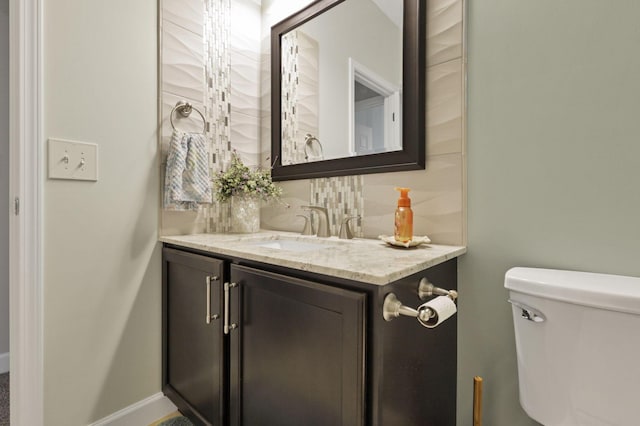 217 Warbler Ct, Pickerington, OH 43147 - bathroom featuring vanity, decorative backsplash, and toilet
