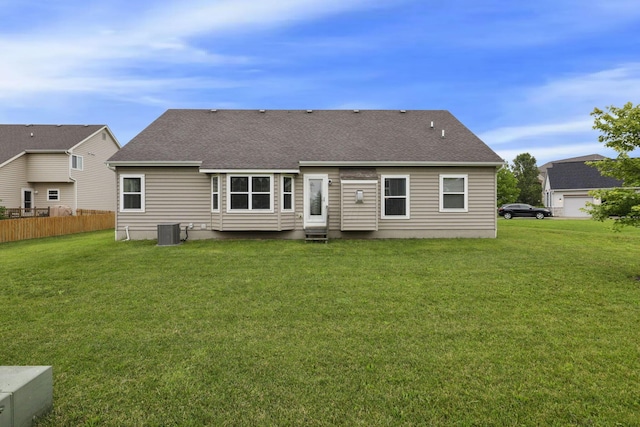 217 Warbler Ct, Pickerington, OH 43147 - back of property with central air condition unit, roof with shingles, and entry steps
