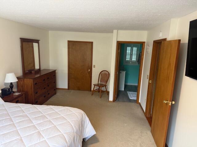 14629 Hock Hocking Rd, Logan, OH 43138 - carpeted bedroom featuring a textured ceiling