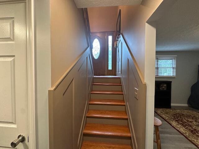 14629 Hock Hocking Rd, Logan, OH 43138 - staircase featuring wood finished floors and a textured ceiling