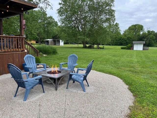 14629 Hock Hocking Rd, Logan, OH 43138 - view of patio / terrace with an outdoor fire pit