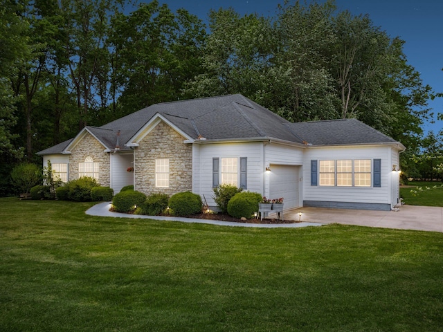 1397 Horseshoe Rd, Delaware, OH 43015 - ranch-style home with a front yard, a garage, concrete driveway, stone siding, and roof with shingles