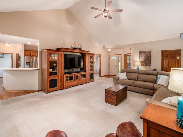 1397 Horseshoe Rd, Delaware, OH 43015 - living room featuring a ceiling fan, high vaulted ceiling, light colored carpet, and baseboards
