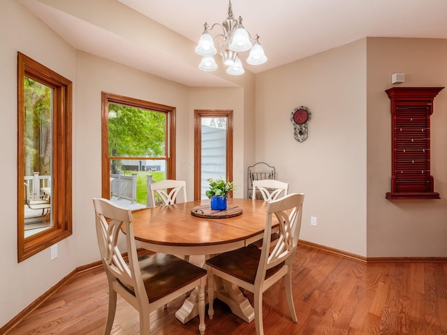 1397 Horseshoe Rd, Delaware, OH 43015 - dining space with baseboards, light wood-type flooring, and a chandelier