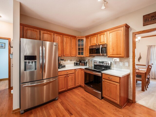 1397 Horseshoe Rd, Delaware, OH 43015 - kitchen with stainless steel appliances, light wood-style flooring, and light countertops