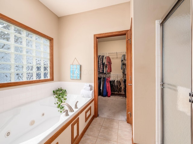 1397 Horseshoe Rd, Delaware, OH 43015 - full bathroom with a stall shower, tile patterned flooring, a jetted tub, and a walk in closet