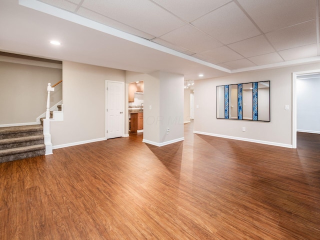 1397 Horseshoe Rd, Delaware, OH 43015 - unfurnished living room with baseboards, stairway, wood finished floors, a paneled ceiling, and recessed lighting