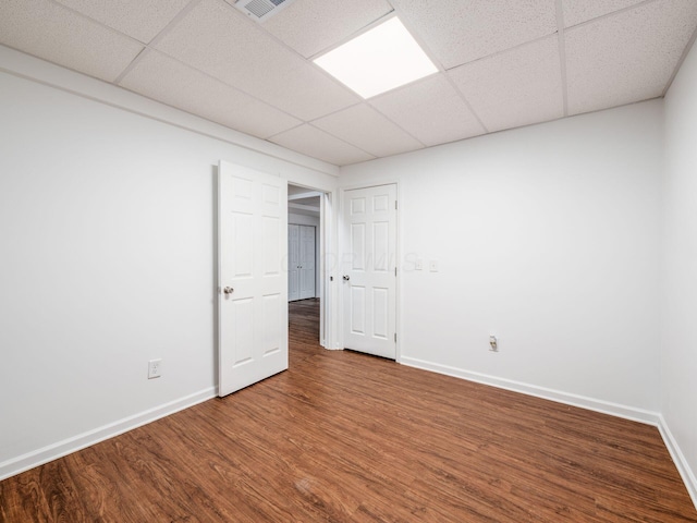 1397 Horseshoe Rd, Delaware, OH 43015 - unfurnished bedroom with baseboards, wood finished floors, and a paneled ceiling