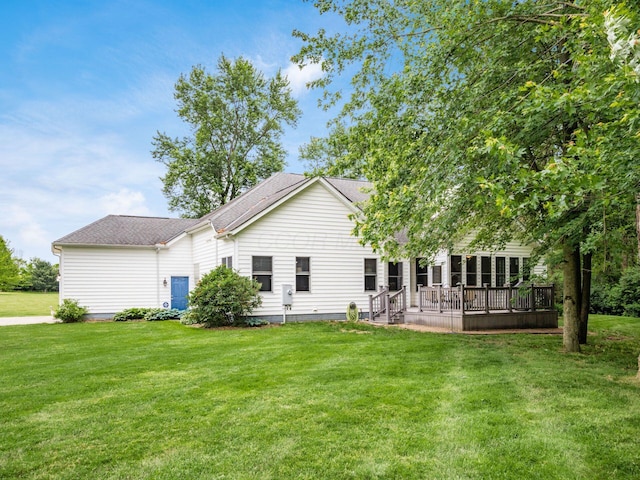 1397 Horseshoe Rd, Delaware, OH 43015 - back of house with a lawn, a shingled roof, and a deck