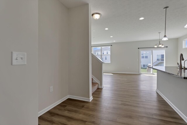 211 Whitetail Trl, Johnstown, OH 43031 - corridor featuring plenty of natural light, stairs, dark wood-style floors, recessed lighting, and baseboards