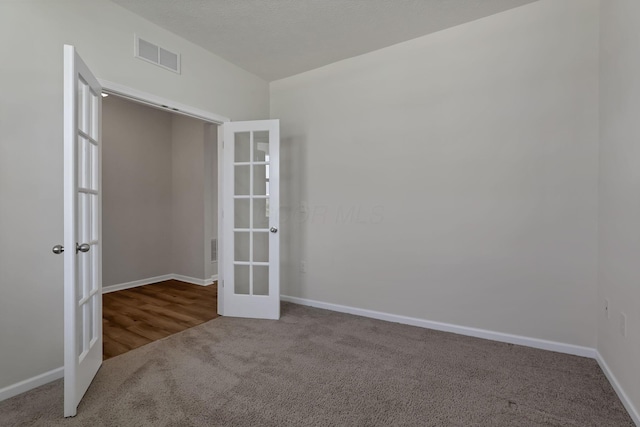 211 Whitetail Trl, Johnstown, OH 43031 - carpeted spare room with french doors and baseboards