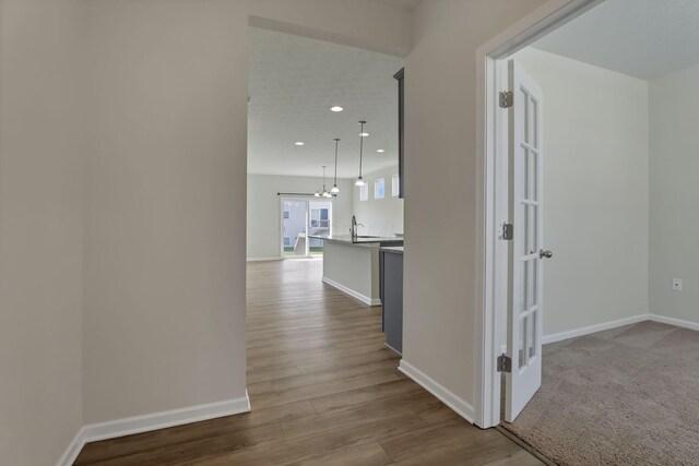211 Whitetail Trl, Johnstown, OH 43031 - corridor with baseboards, dark wood-style floors, a sink, and recessed lighting
