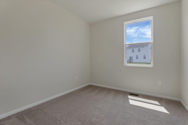 211 Whitetail Trl, Johnstown, OH 43031 - carpeted empty room featuring baseboards