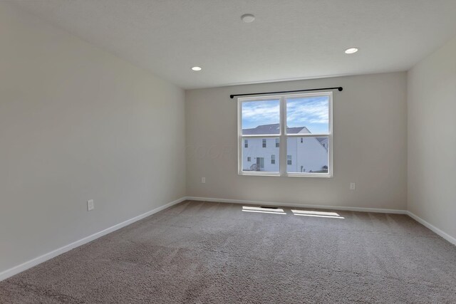 211 Whitetail Trl, Johnstown, OH 43031 - spare room featuring carpet floors, baseboards, and recessed lighting
