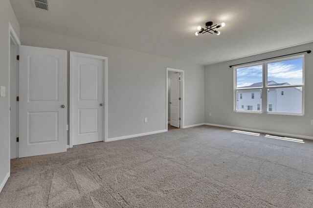 211 Whitetail Trl, Johnstown, OH 43031 - unfurnished bedroom featuring carpet and baseboards