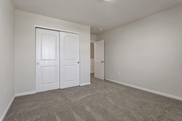 211 Whitetail Trl, Johnstown, OH 43031 - unfurnished bedroom featuring carpet, baseboards, and a closet