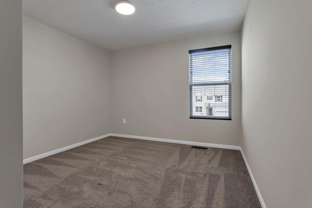 211 Whitetail Trl, Johnstown, OH 43031 - carpeted empty room featuring baseboards