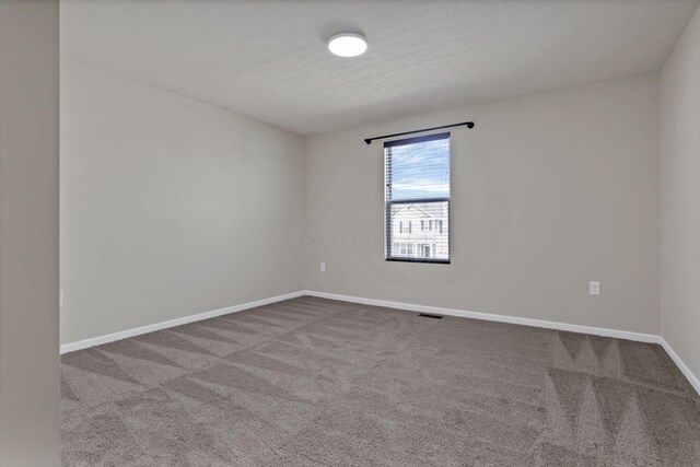 211 Whitetail Trl, Johnstown, OH 43031 - empty room with carpet floors and baseboards