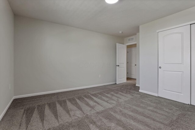 211 Whitetail Trl, Johnstown, OH 43031 - unfurnished bedroom with carpet flooring, baseboards, and a closet