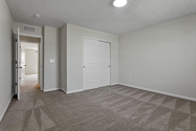 211 Whitetail Trl, Johnstown, OH 43031 - unfurnished bedroom featuring carpet flooring, baseboards, and a closet