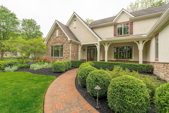 7699 Clear Creek Ct, Blacklick, OH 43004 - view of front of home featuring stucco siding, stone siding, and a front yard