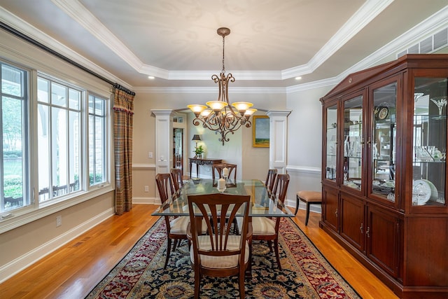 7699 Clear Creek Ct, Blacklick, OH 43004 - dining area with a chandelier, light wood-type flooring, baseboards, crown molding, and a tray ceiling