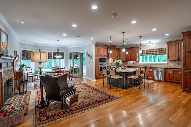 7699 Clear Creek Ct, Blacklick, OH 43004 - living area with recessed lighting, light wood-style floors, and ornamental molding