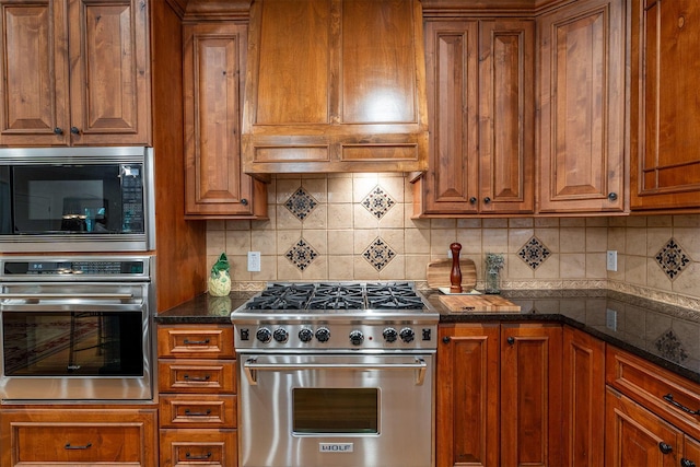 7699 Clear Creek Ct, Blacklick, OH 43004 - kitchen with stainless steel appliances, brown cabinetry, and tasteful backsplash