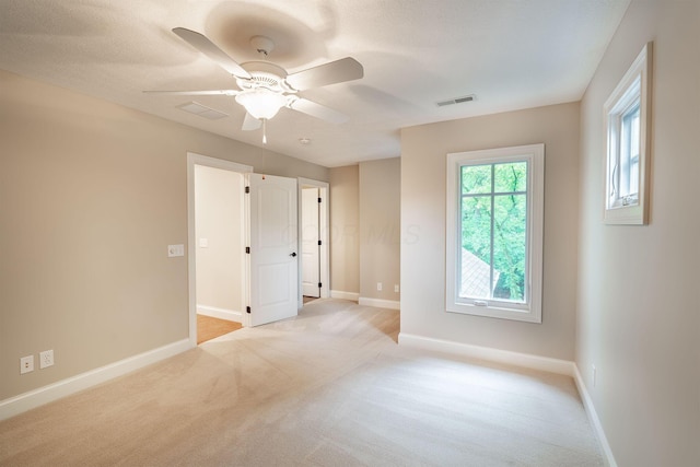 7699 Clear Creek Ct, Blacklick, OH 43004 - empty room with light colored carpet, baseboards, and ceiling fan