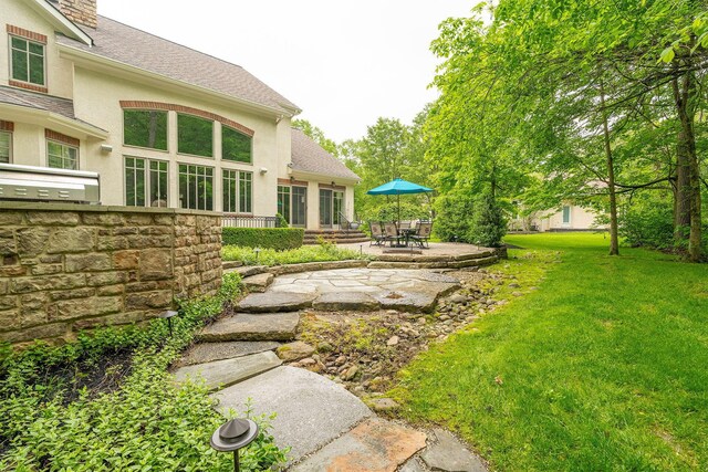 7699 Clear Creek Ct, Blacklick, OH 43004 - view of grassy yard with a patio area