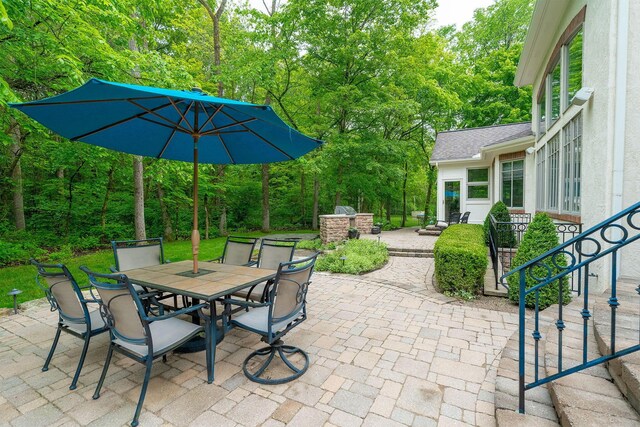7699 Clear Creek Ct, Blacklick, OH 43004 - view of patio / terrace featuring outdoor dining area and view of wooded area