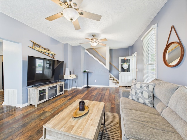 1708 Cedar Hill Rd, Lancaster, OH 43130 - living area featuring wood finished floors, stairway, ceiling fan, a textured ceiling, and healthy amount of natural light