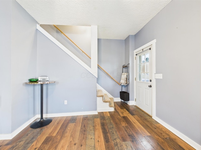 1708 Cedar Hill Rd, Lancaster, OH 43130 - entrance foyer with stairs, wood-type flooring, baseboards, and a textured ceiling