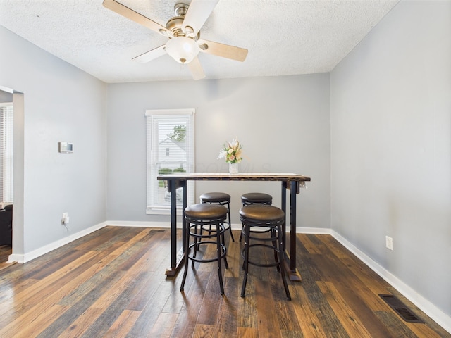 1708 Cedar Hill Rd, Lancaster, OH 43130 - dining area with dark wood-style floors, ceiling fan, a textured ceiling, and baseboards