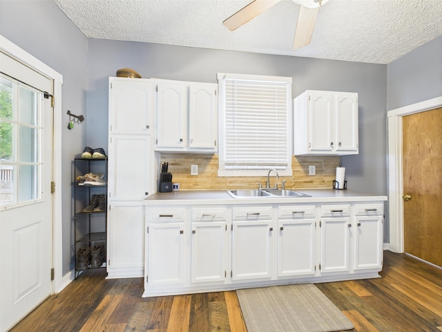 1708 Cedar Hill Rd, Lancaster, OH 43130 - kitchen featuring a sink, white cabinets, light countertops, tasteful backsplash, and dark wood-style floors