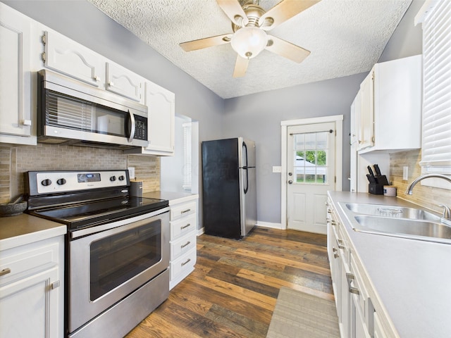 1708 Cedar Hill Rd, Lancaster, OH 43130 - kitchen featuring appliances with stainless steel finishes, a sink, a textured ceiling, white cabinetry, and backsplash