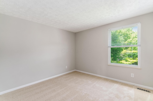 3248 Medoma Dr, Columbus, OH 43204 - unfurnished room featuring light colored carpet and a textured ceiling