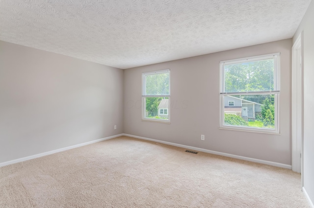 3248 Medoma Dr, Columbus, OH 43204 - empty room with light carpet and a textured ceiling