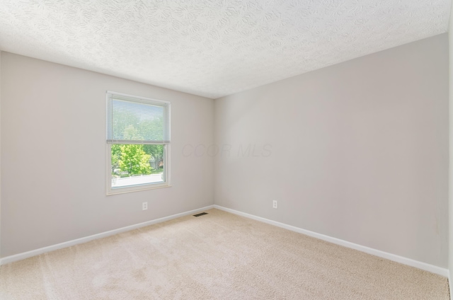 3248 Medoma Dr, Columbus, OH 43204 - unfurnished room with light colored carpet and a textured ceiling