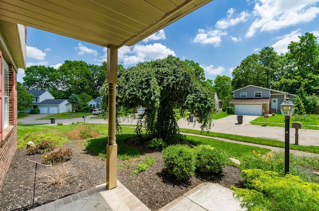 3248 Medoma Dr, Columbus, OH 43204 - view of grassy yard featuring a garage and driveway
