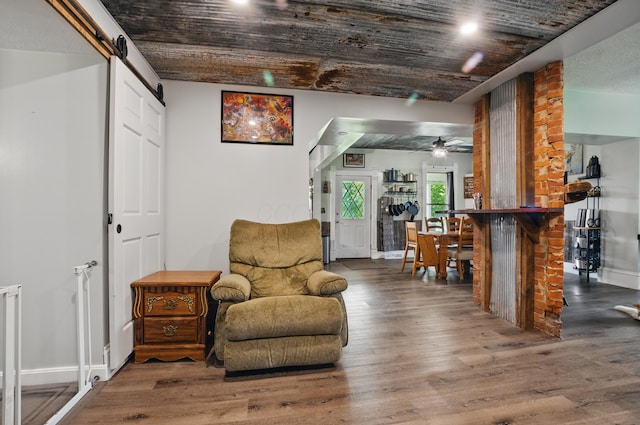 1282 Taylortown Rd, Mansfield, OH 44903 - sitting room with wood finished floors, ceiling fan, baseboards, and a barn door