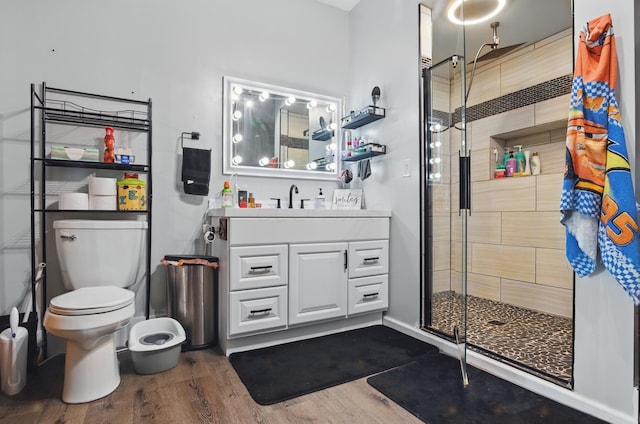 1282 Taylortown Rd, Mansfield, OH 44903 - full bathroom featuring wood finished floors, a stall shower, vanity, and toilet