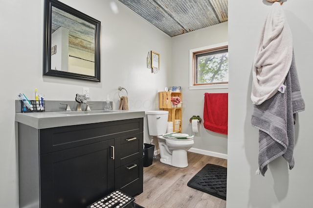 1282 Taylortown Rd, Mansfield, OH 44903 - half bath with toilet, wood finished floors, vanity, and baseboards