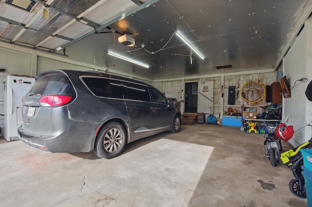 1282 Taylortown Rd, Mansfield, OH 44903 - garage with a garage door opener, electric panel, and water heater