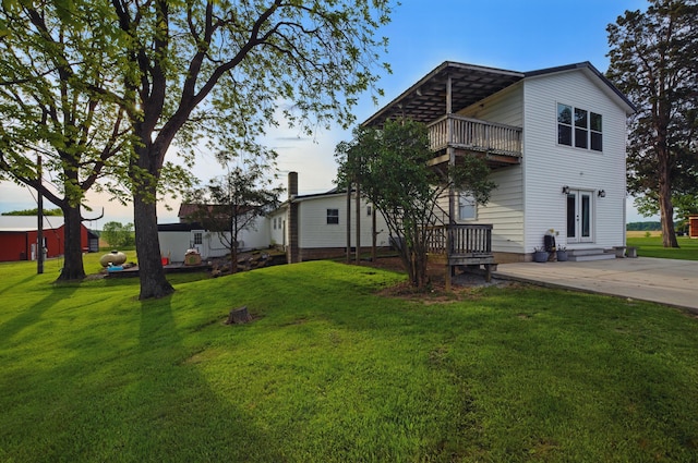1282 Taylortown Rd, Mansfield, OH 44903 - back of property featuring a balcony, a yard, and entry steps