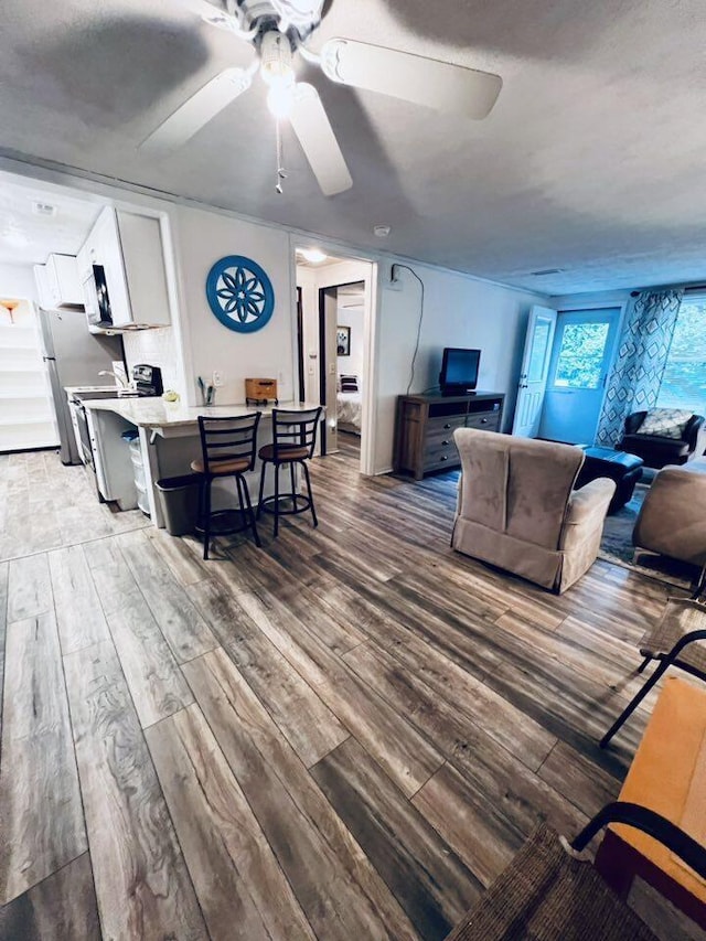3037 La Vista Dr Unit 39, Columbus, OH 43204 - living room featuring wood finished floors and ceiling fan