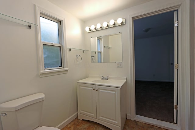 301 W Marion St, Mount Gilead, OH 43338 - bathroom featuring vanity, toilet, and baseboards
