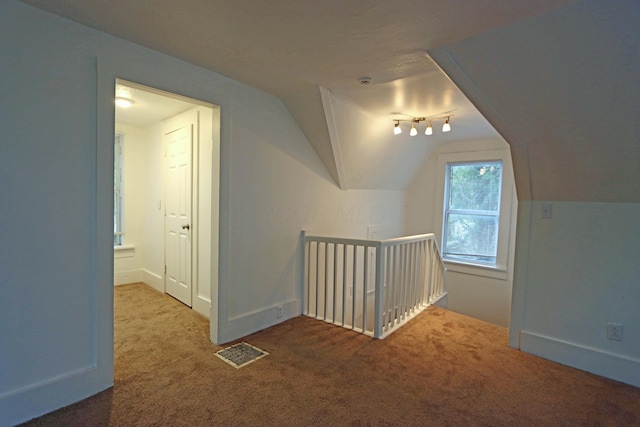 301 W Marion St, Mount Gilead, OH 43338 - additional living space with carpet flooring, vaulted ceiling, and baseboards