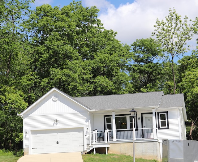 187 Twin Creek Way, Lancaster, OH 43130 - ranch-style home featuring a porch, driveway, a garage, a shingled roof, and board and batten siding