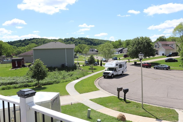 187 Twin Creek Way, Lancaster, OH 43130 - view of asphalt street featuring a residential view, street lighting, sidewalks, and curbs